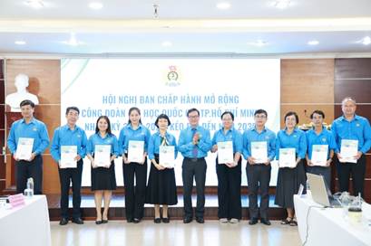 A group of people holding certificatesAI-generated content may be incorrect.